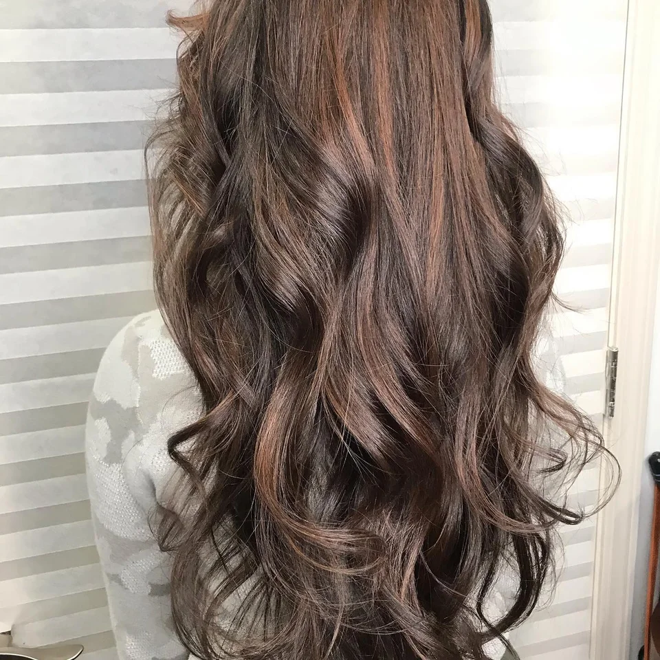 Long brunette waves with subtle rose-brown highlights