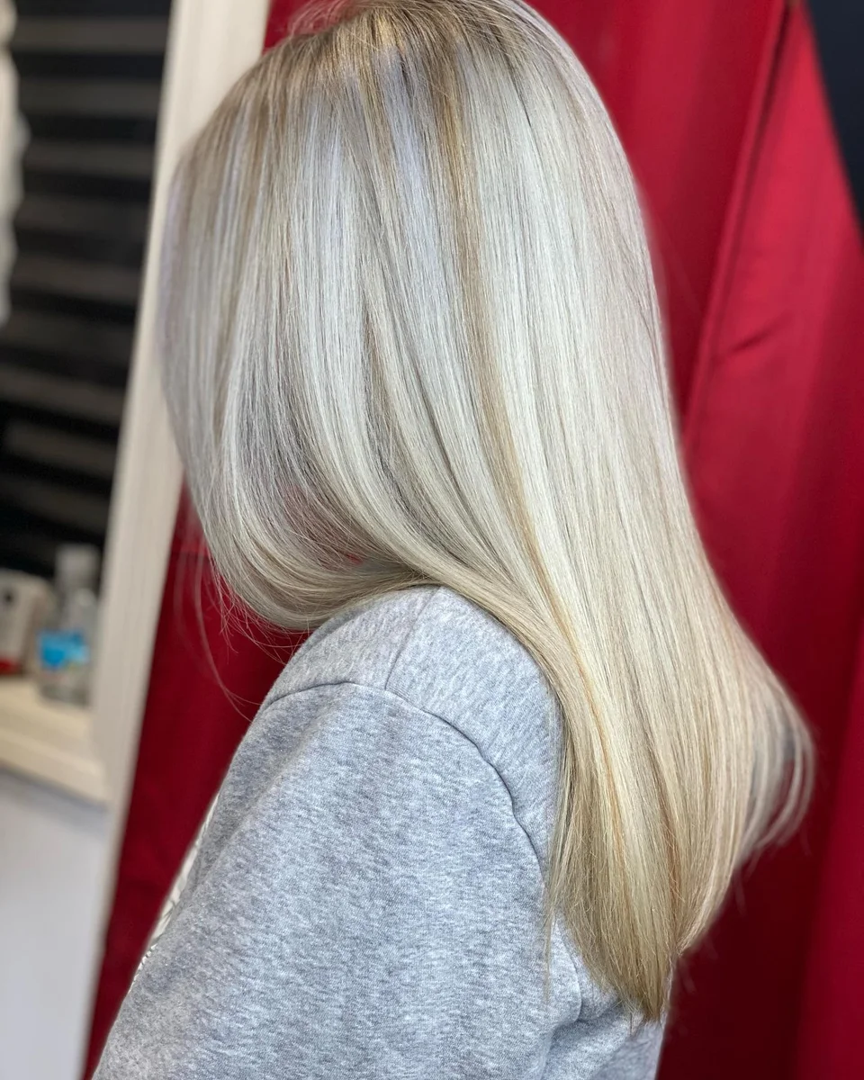 Long pearl blonde hair with a sleek finish