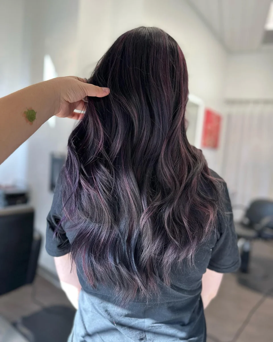 Long black hair with subtle violet ribbons