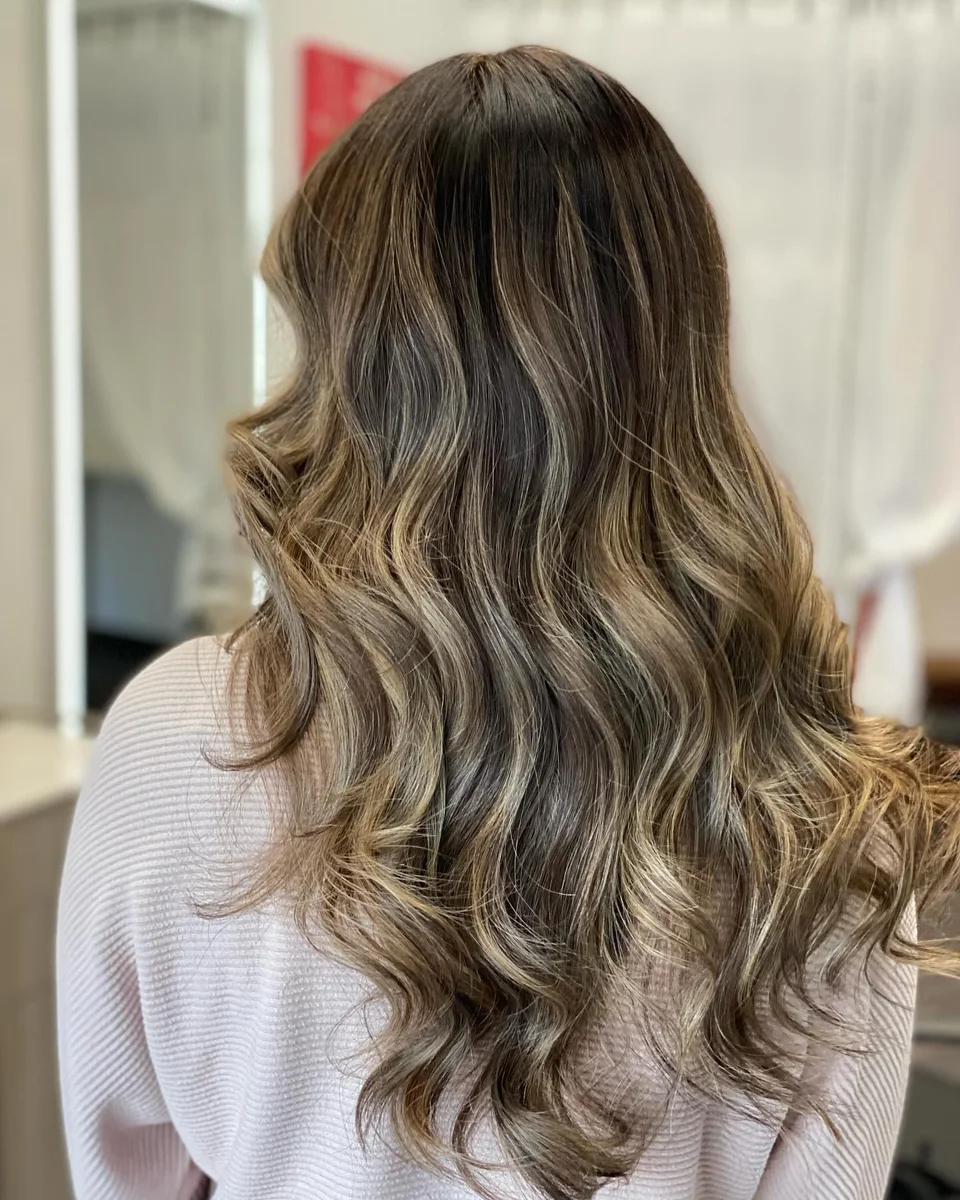 Brunette balayage with soft caramel waves