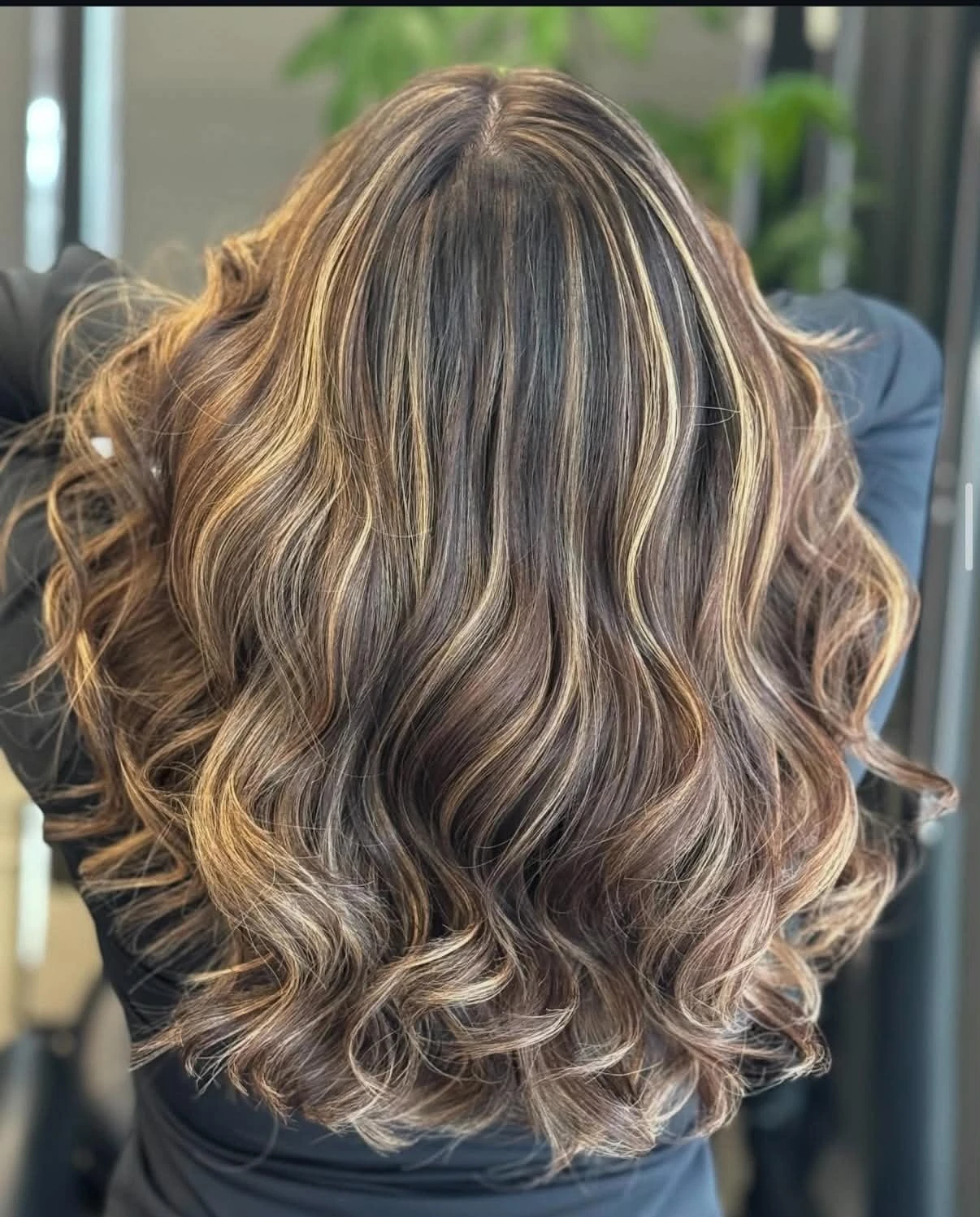 Brunette waves with dimensional ribbon highlights