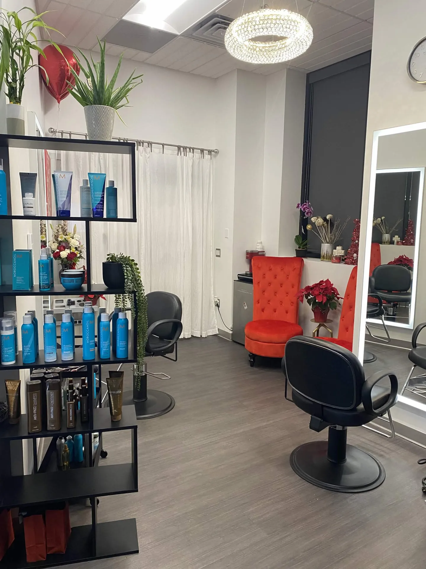 A close view of the salon floor, styling chairs, mirrors, and professional products