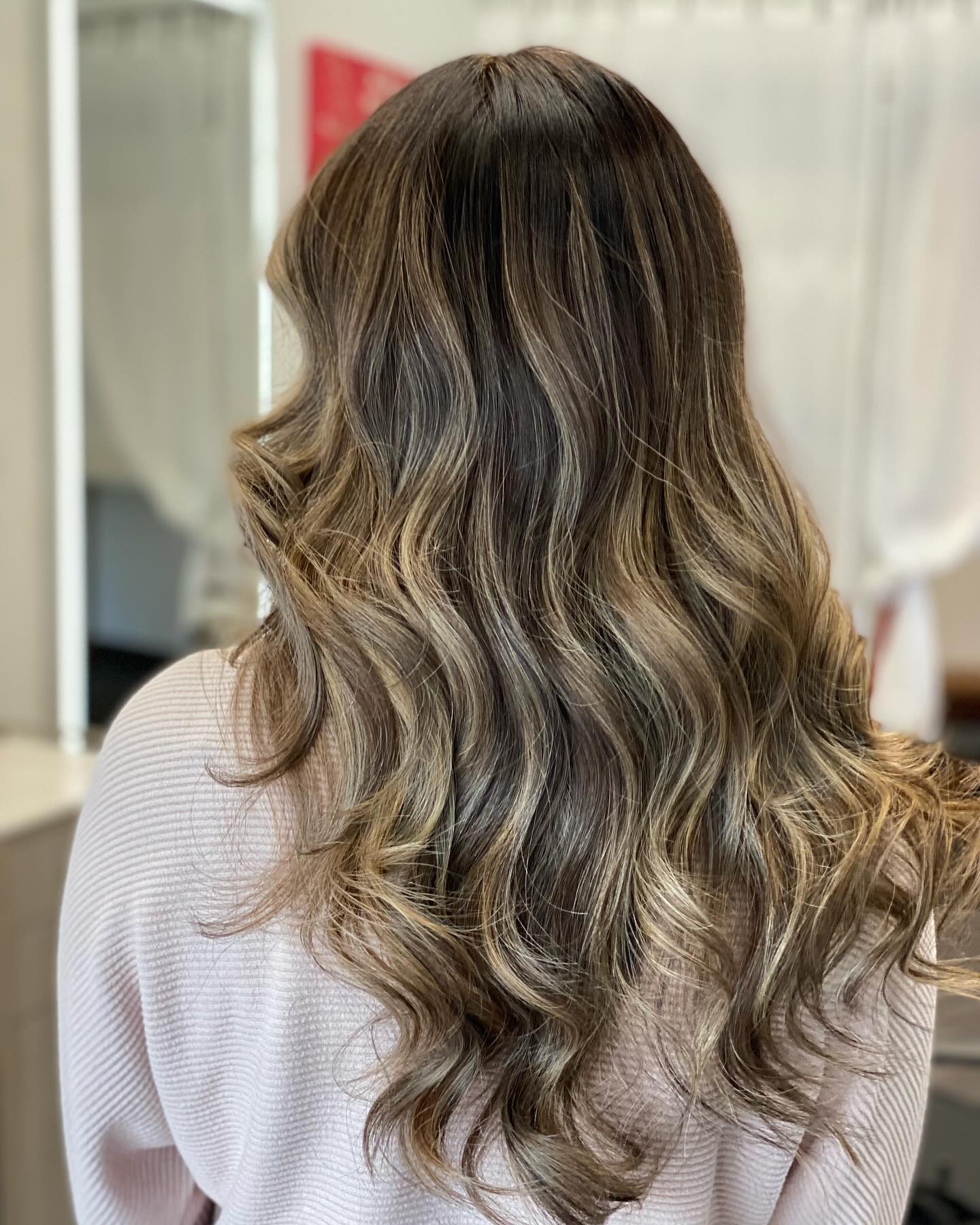 Brunette balayage with soft caramel waves